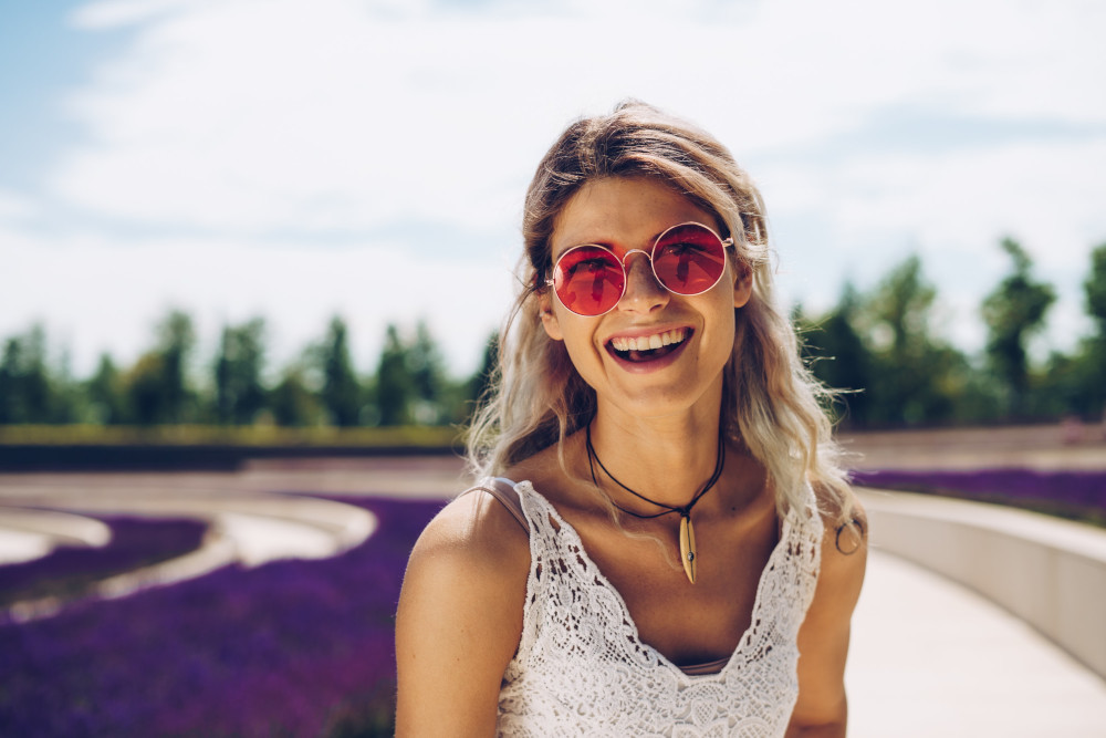 woman in red glasses smiling