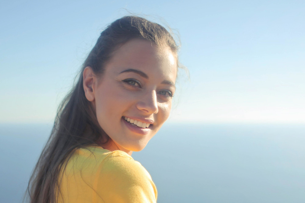 woman in yellow shirt